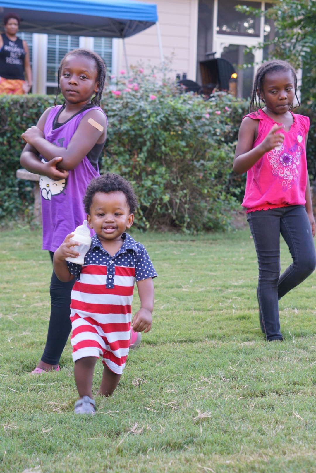 Toddler Boy Avery with Twin Girls on Labor Day in Powder Springs, GA. Shot by Atlanta Lifestyle Photographer Crystal King of Just The Kings. We also shoot engagement photos, wedding photos, pregnancy photos, birthing photos, and family portraits in Austell, Powder Springs, Vinings, Marietta, Cobb County, and surrounding Metro Atlanta. Visit us at www.justthekings.com