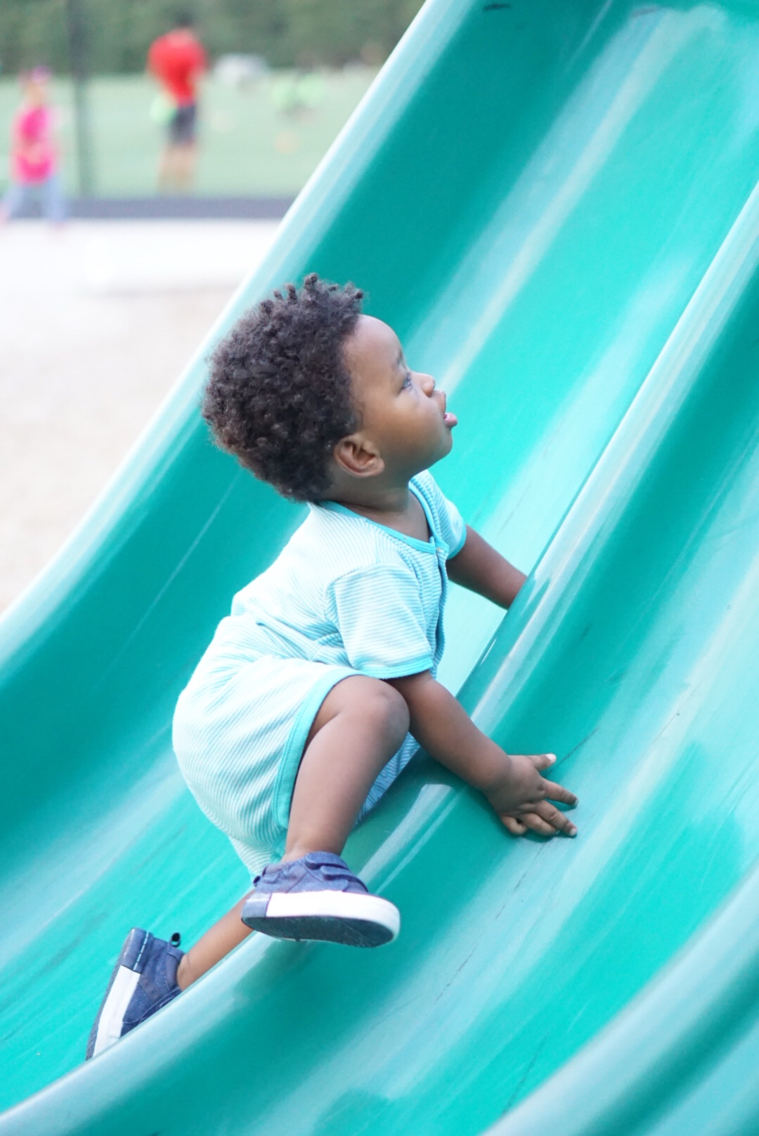 toddler climbing slide Mudcreek Park in Austell, GA. Shot by Atlanta Lifestyle Photographer Crystal King of Just The Kings. We also shoot engagement photos, wedding photos, pregnancy photos, birthing photos, and family portraits in Austell, Powder Springs, Vinings, Marietta, Cobb County, and surrounding Metro Atlanta. Visit us at www.justthekings.com